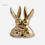 Lapins dorés en céramique comme serre-livre élégant