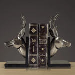 Serre-livre cuivre en forme de têtes de cerf
