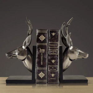 Serre-livre cuivre en forme de têtes de cerf