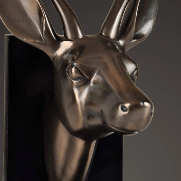 Objet en cuivre : serre-livre têtes de cerf