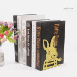 Serre-livre en métal avec lapins à la pipe